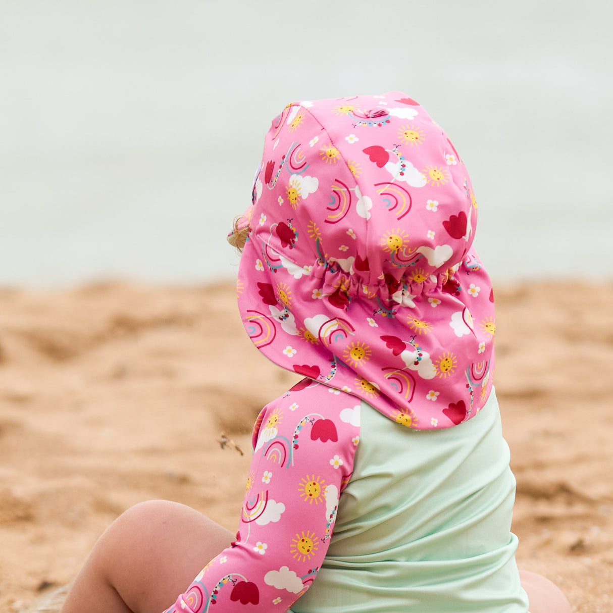 UPF 40+ Reversible Swim Hat for Babies and Toddlers in Happy Days